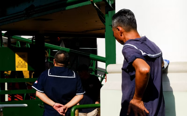 Workers entering a warehouse
